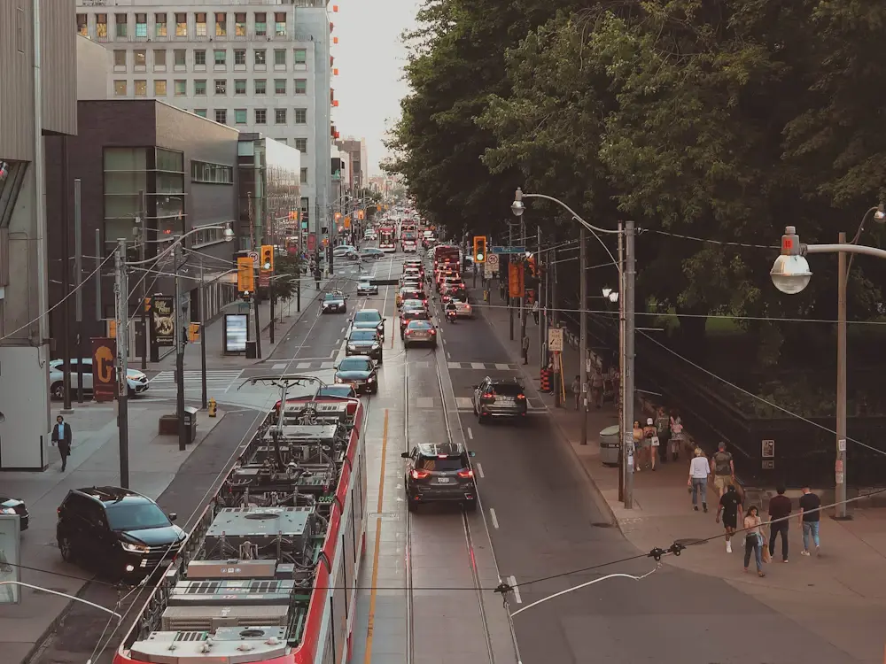 Streetcars and storefronts along Queen Street West